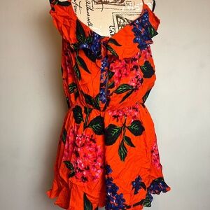 Bright Orange Floral Romper with Ruffled Details